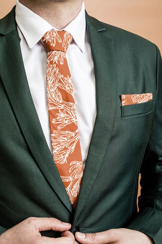 Stylish 100% cotton pocket square inspired by the vibrant and unusual flower heads of the Kangaroo Paw, rendered in burnt orange and white