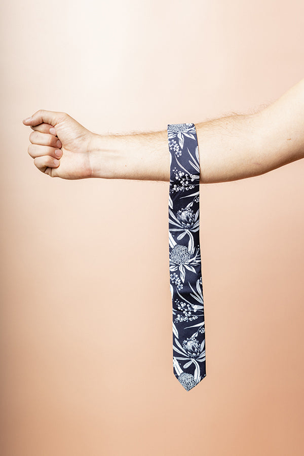 Men's cotton tie showcasing a beautiful print of native Australian flowers, ideal for formal occasions Cotton tie featuring a detailed native Australian flora print, perfect for nature lovers