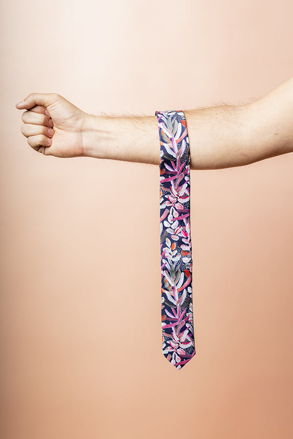 Elegant men's tie in navy with a sophisticated protea flower pattern, perfect for adding a touch of botanical charm to formal attire