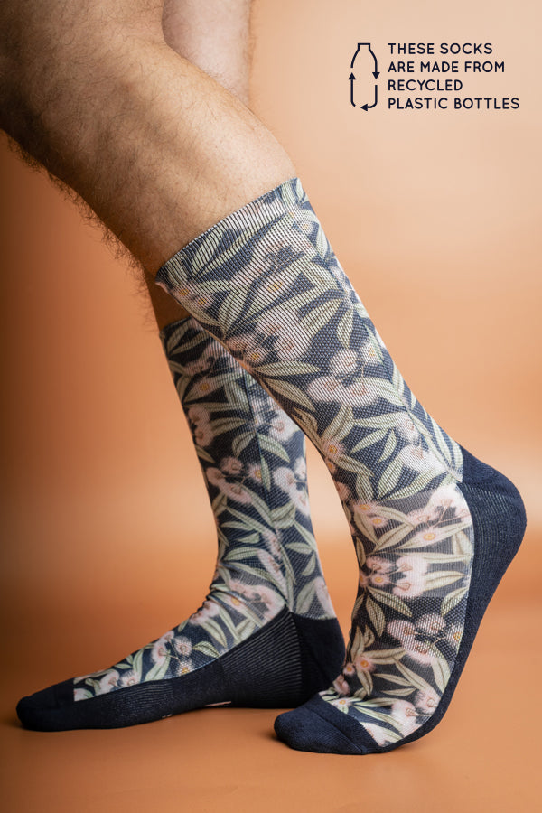Recycled polyester socks adorned with Australian Flowering Gum, blending pink floral patterns with a serene blue base
