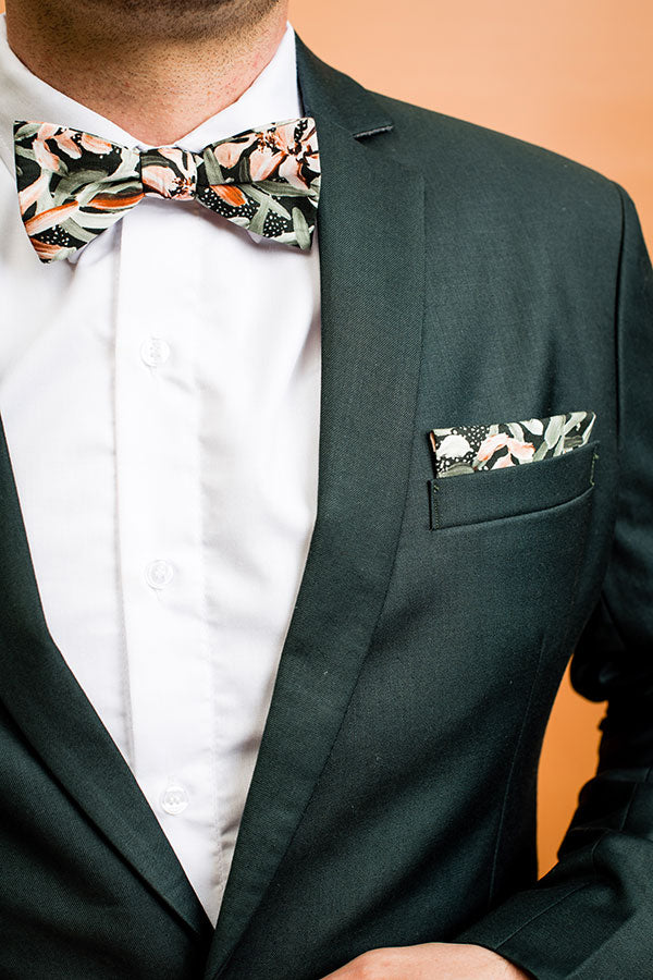 Stylish 100% cotton pocket square with a classic green background and white protea patterns, designed to elevate any suit
