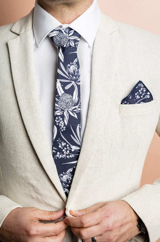 Stylish navy and white pocket square showcasing a range of Australian native flowers, offering a classic and elegant accessory option