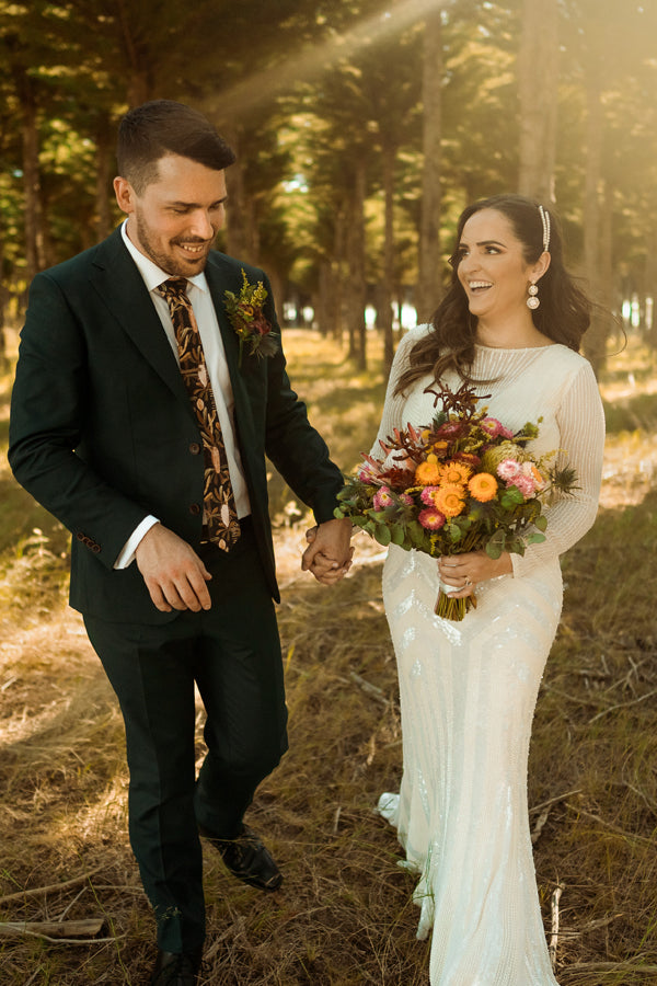 Elegant black cotton tie featuring a subtle Grass Tree pattern, inspired by the resilience of Australian bush flora