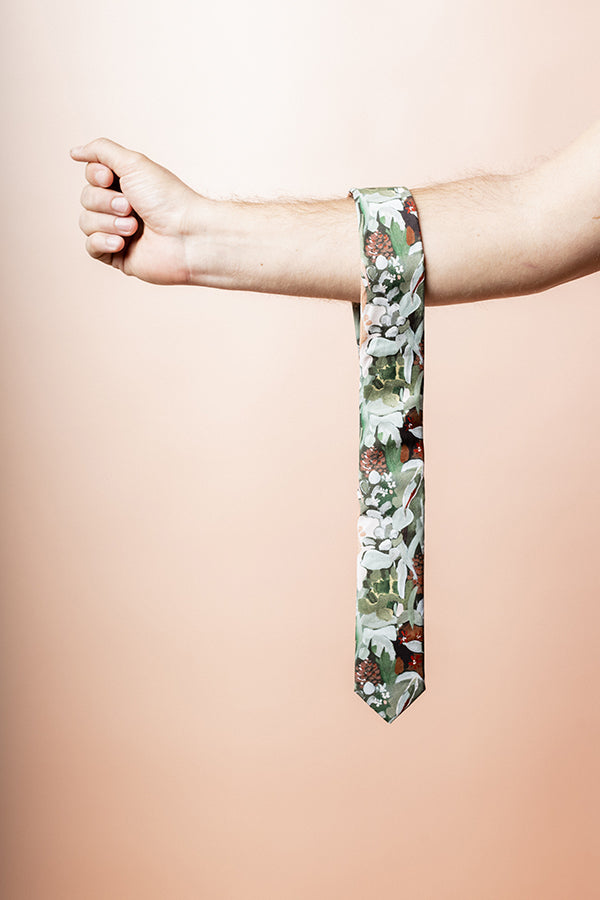 Elegant men's tie in green with a sophisticated spotted gum leaf design, perfect for adding a touch of nature-inspired style to formal wear