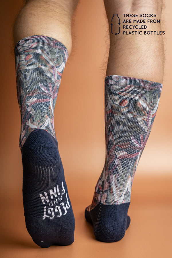 Eco-friendly socks in navy, featuring a Protea flower print in shades of pink and white, perfect for sustainable style