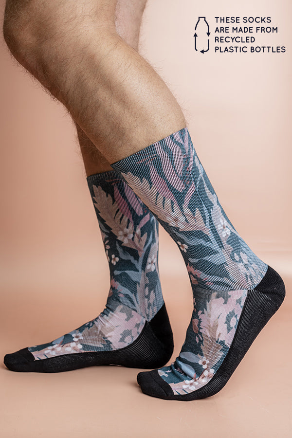Recycled polyester socks showcasing a lush floral design on a teal base, perfect for adding a pop of color and environmental consciousness to any outfit